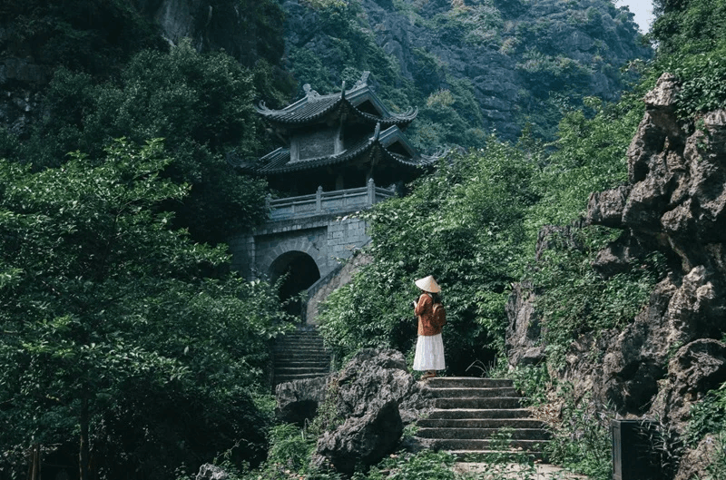 Ancient Am Tien Pagoda nestled into limestone cliffs.