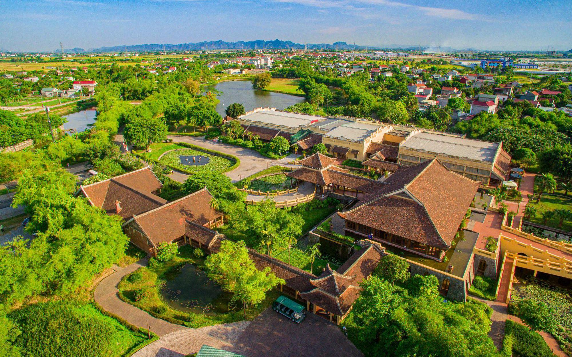 An aerial perspective of Emeralda Resort, one of the established luxury hotels in Ninh Binh featuring traditional Vietnamese architecture