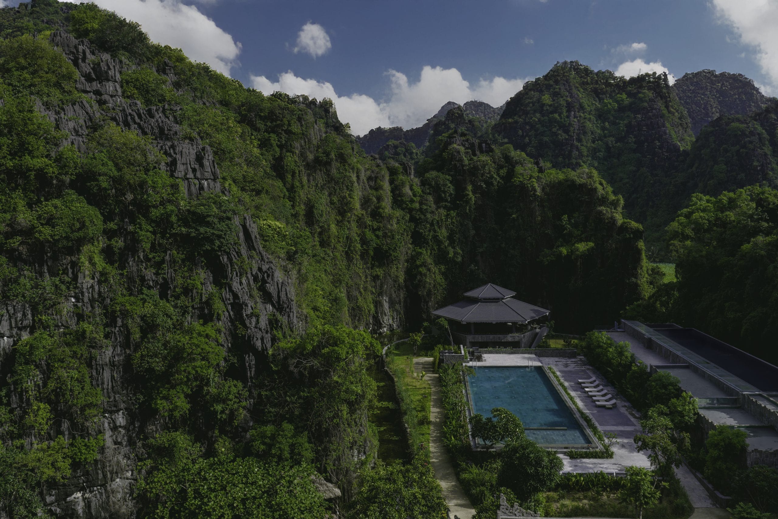 A private resort overlooking the UNESCO World Heritage karst towers, offering a front-row seat to nature.