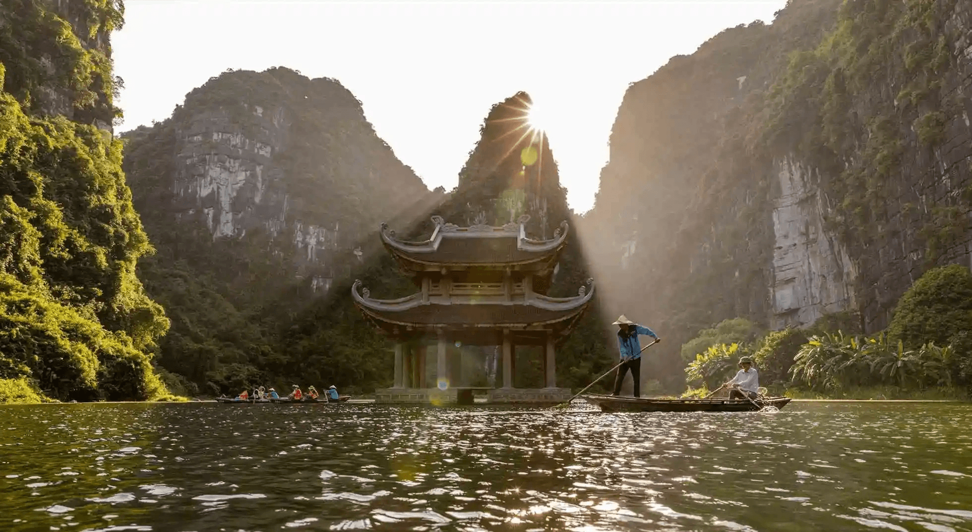 Sailing through the serene waterways and dramatic limestone cave systems of the UNESCO-listed Trang An complex.