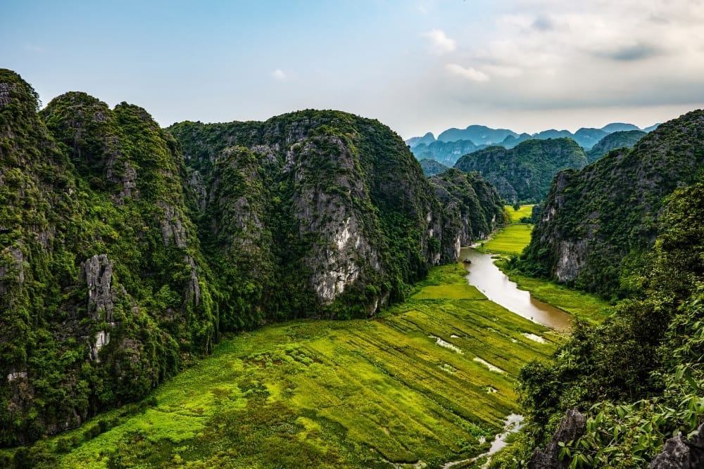 The lush green landscape and towering cliffs that make the region "Halong Bay on Land."