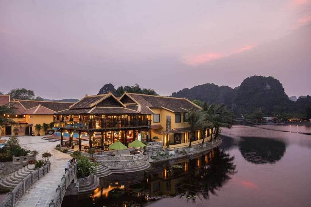 Walking through the red-brick pathways of a sprawling villa cluster that mimics an ancient noble village.