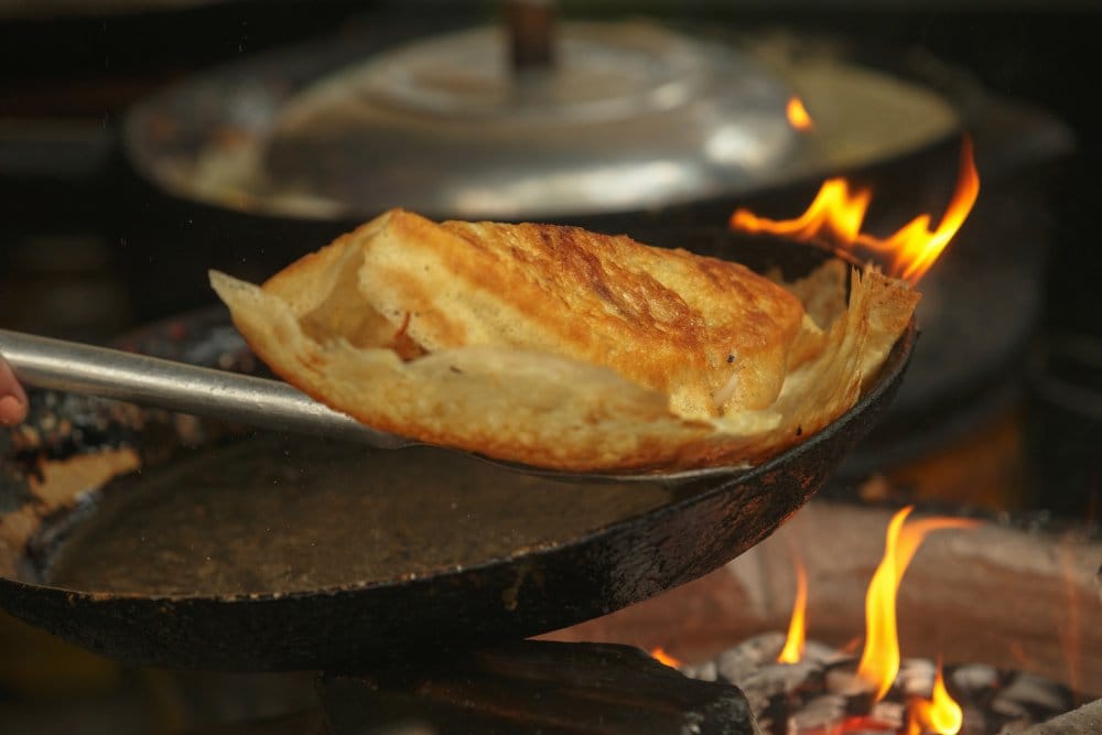 A plate of flavorful goat meat, often grilled or cooked in hotpots, a famous delicacy of Ninh Binh