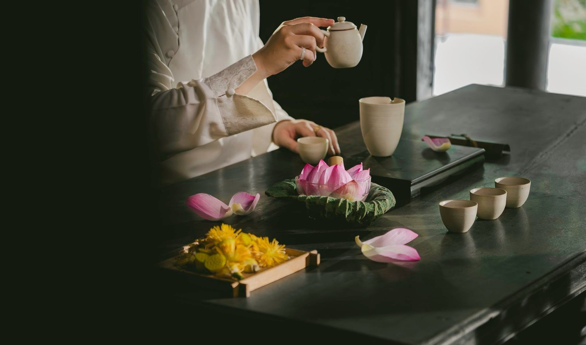 ndulging in a meditative tea ritual at the serene garden setting of the Hoa Lư retreat