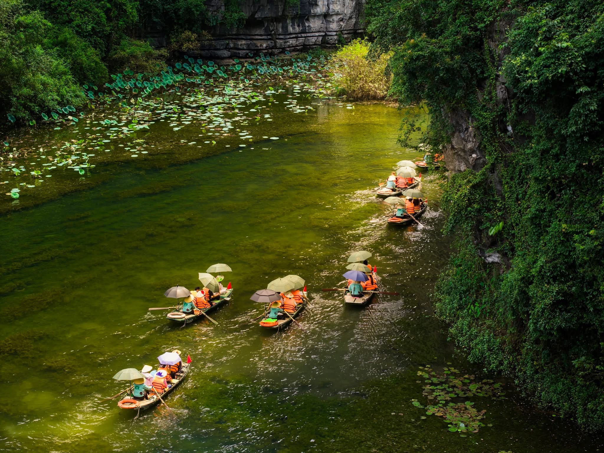 Travelers enjoying the intimate and peaceful journey of a two-hour boat tour, perfect for photography