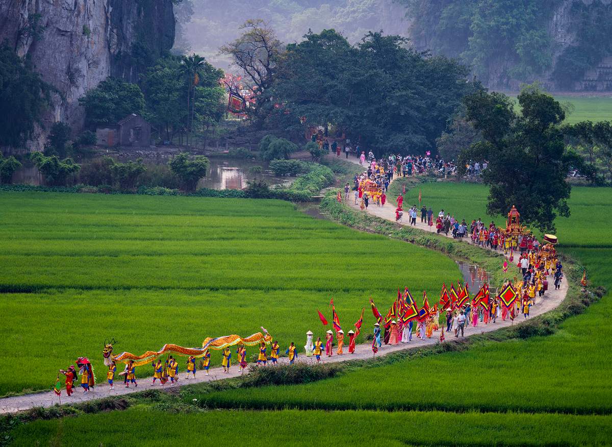 Travelers exploring the unique blend of cultural heritage and spiritual rituals in the Tam Coc region.
