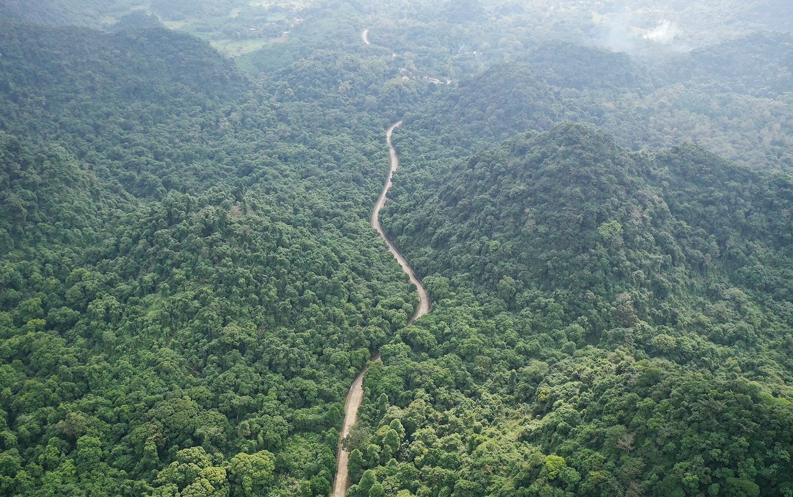 The gentle journey from Hanoi, passing quiet village roads and limestone silhouettes.