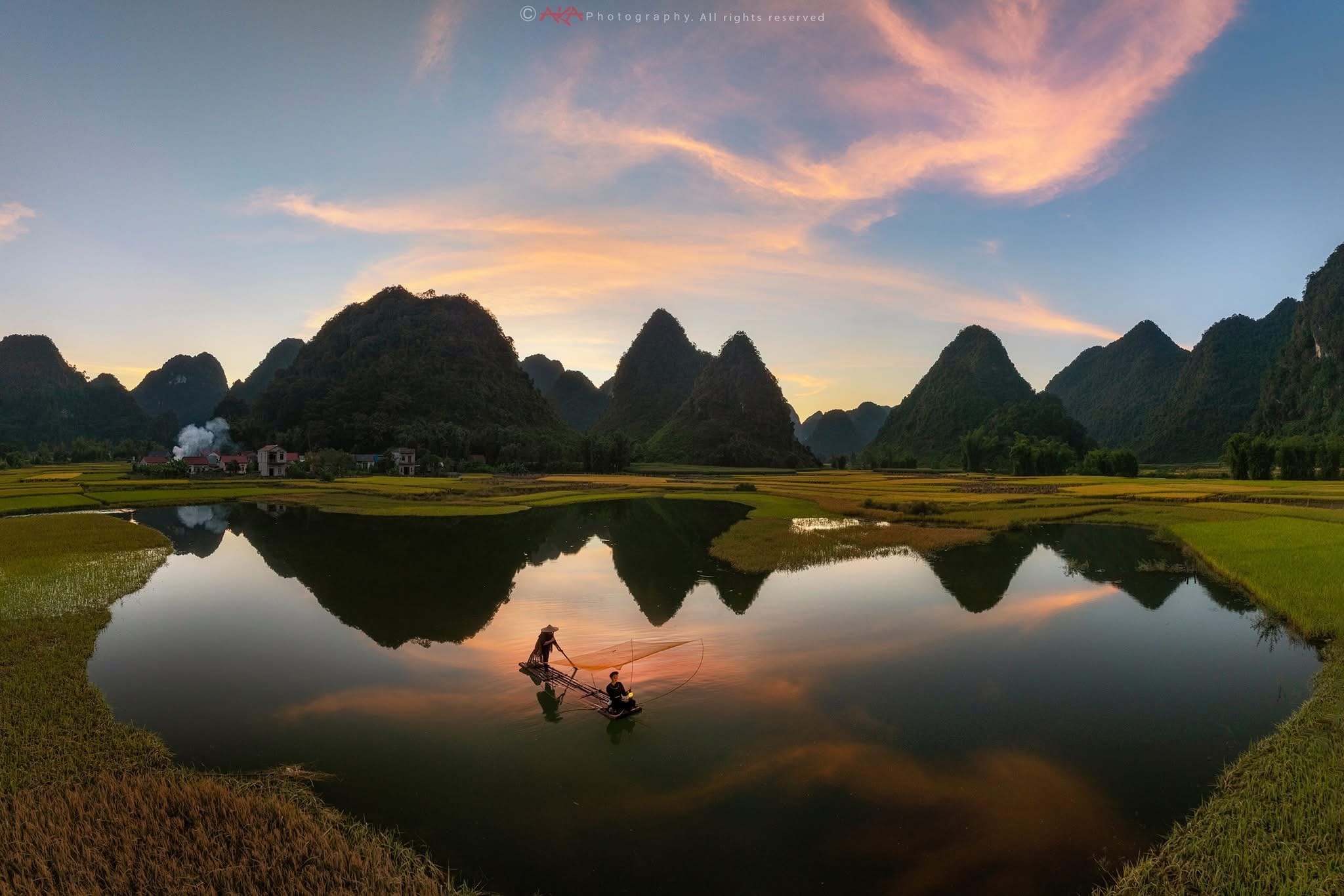 The dramatic landscape of limestone karsts and winding rivers, earning Ninh Binh the title of "Ha Long Bay on Land."