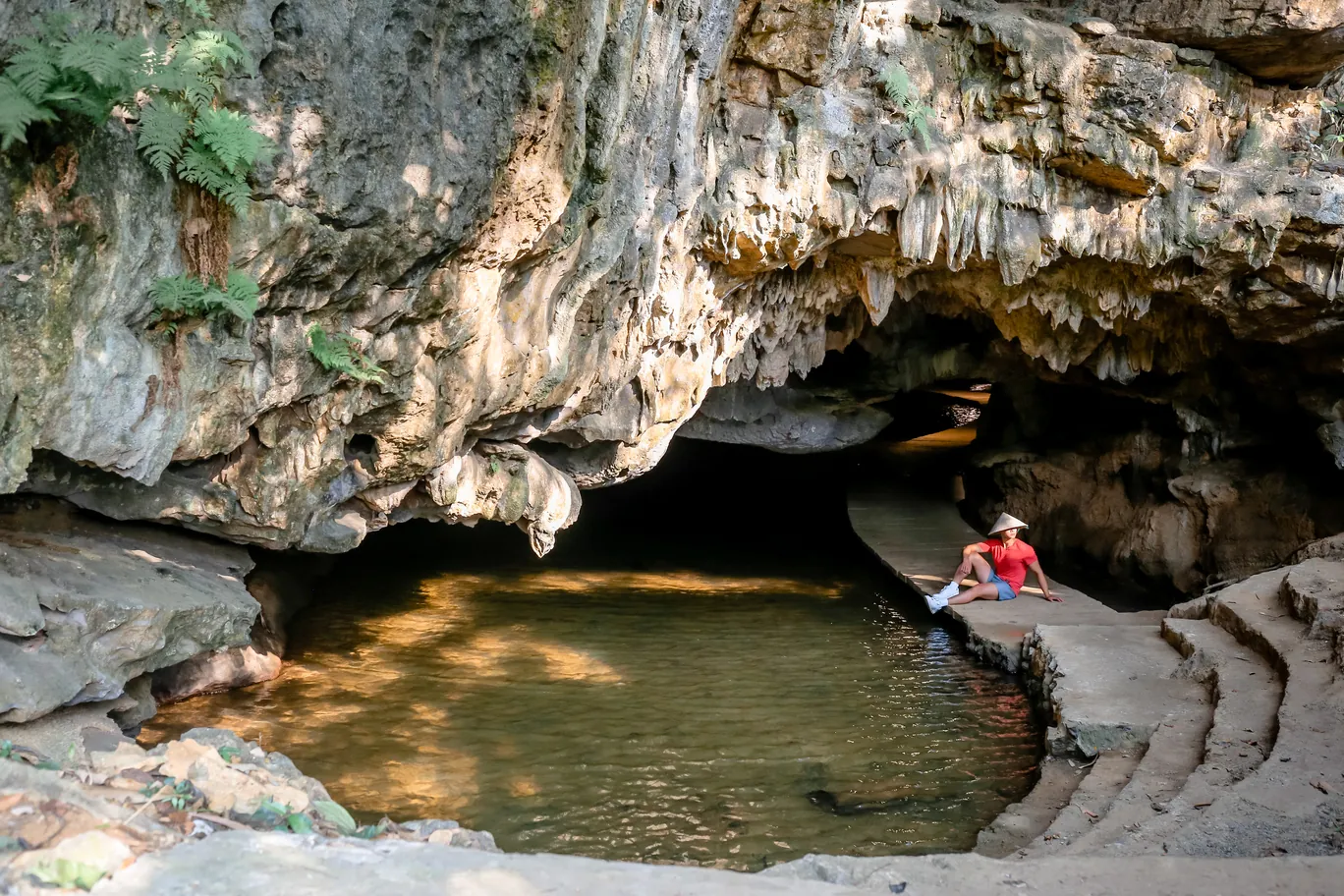 Exploring the narrow, otherworldly passageways of Mermaid Cave, a highlight for adventure seekers.
