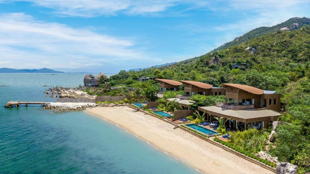 Sustainable timber architecture seamlessly integrated into the jungle and bay environment.