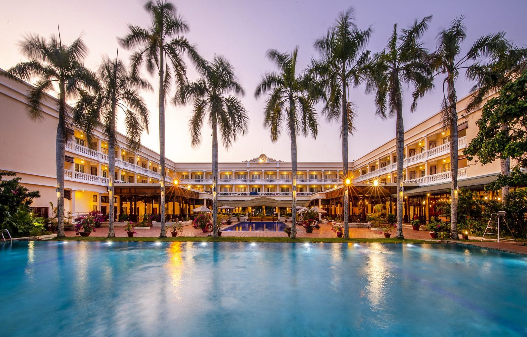 Colonial-style architecture meeting riverine life at Victoria Can Tho Resort, a jewel of the Mekong Delta.