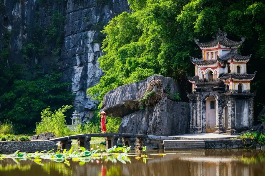 Is a Ninh Binh from Hanoi Tour Worth It? Here’s What You Should Know The ancient three-tiered Bich Dong Pagoda built gracefully into the side of a mountain.