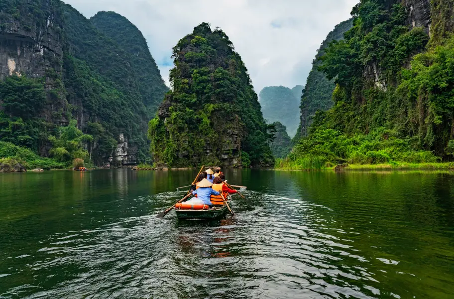 Trang An Boat Tour: Everything You Need to Know About Ninh Binh’s UNESCO Landscape Winding through rural landscapes and vibrant rice fields on a 3-hour journey of discovery.