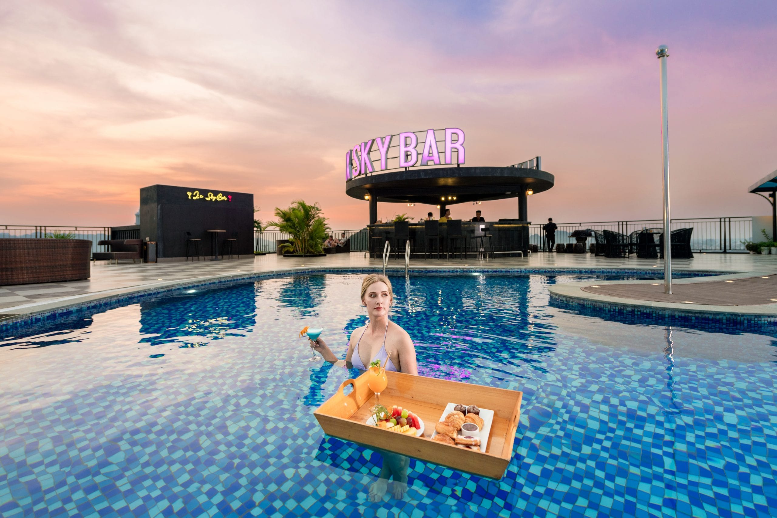Relaxing in the expansive garden and pool area, an oasis of calm within the city limits.