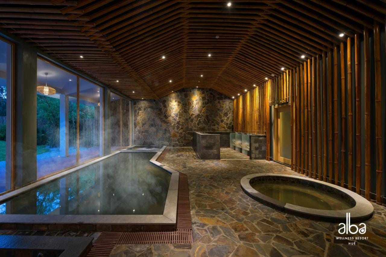 Discerning guests enjoying a structured, traditional Japanese-inspired onsen bathing ritual