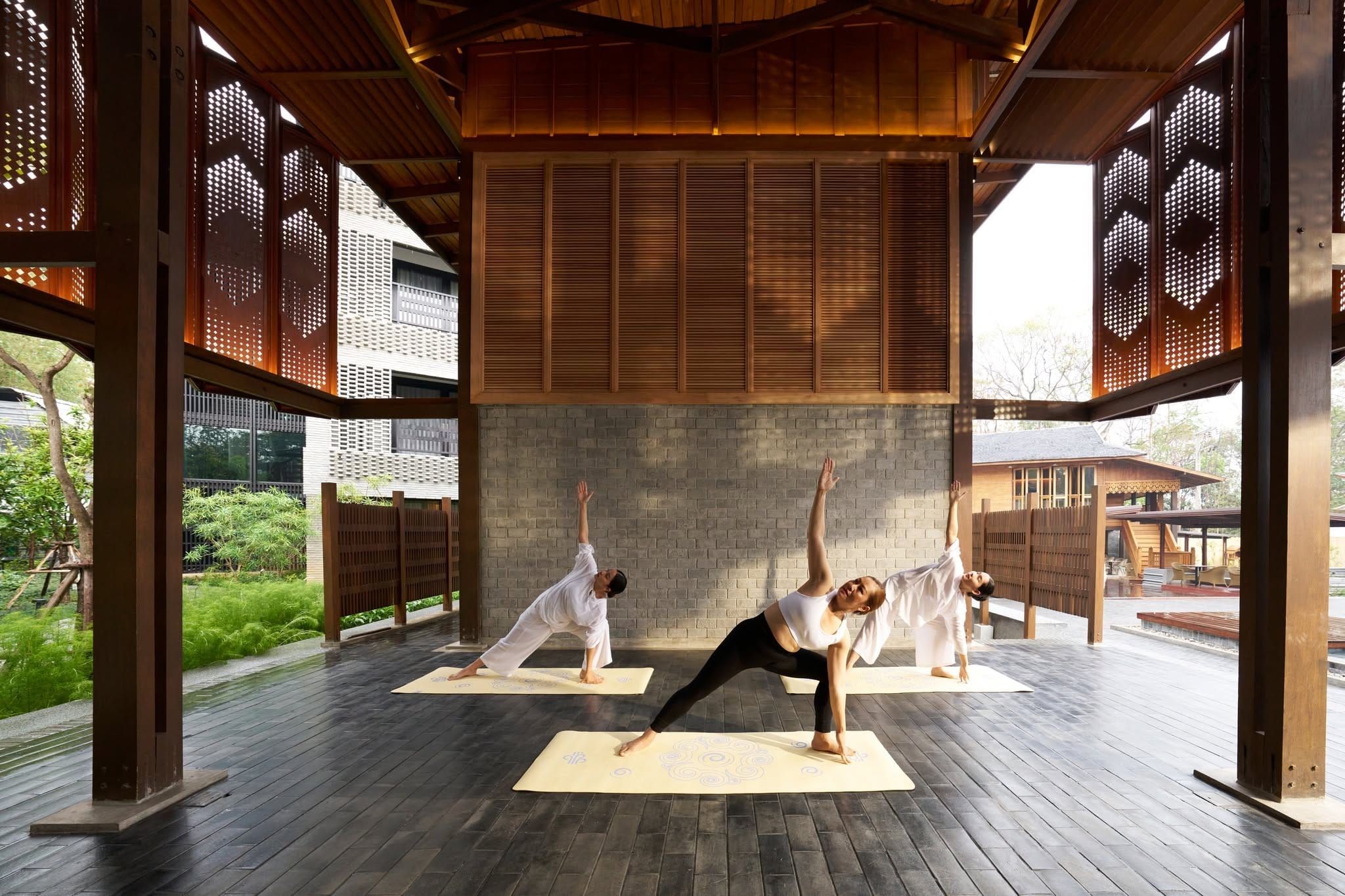 Mindfulness Retreat Asia: A Complete Guide to Peaceful Getaways An international couple learning mindful breathing yoga techniques